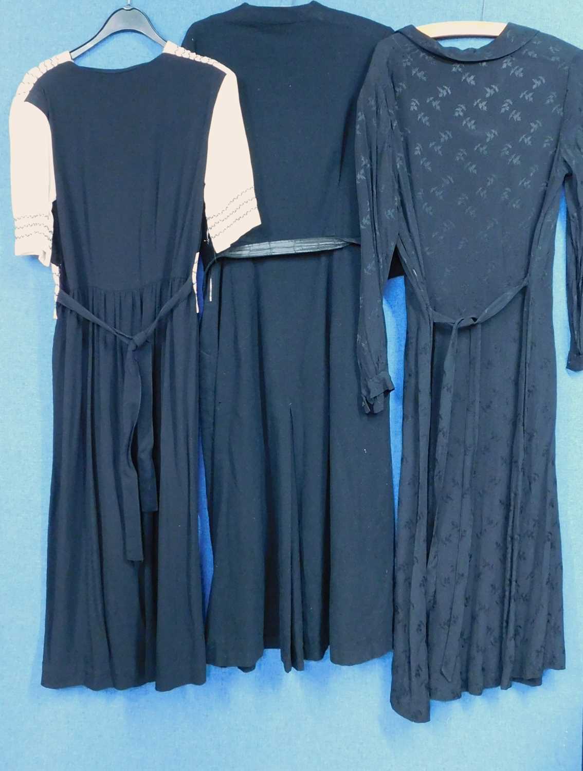 Three mid 20th Century lady's dresses, to include a black and cream short sleeved crepe dress with - Image 2 of 6