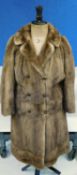 A lady's mid 20th Century double breasted brown mink fur coat, three quarter length with square