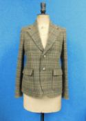 A lady's Ralph Lauren brown tweed jacket, single breasted with two button fastening, front patch
