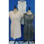 Three circa 1960's cocktail dresses, to include a cream glitter shift dress with rose detail to