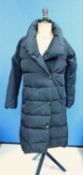A lady's three quarter length black puffer coat by Jaeger, popper fastening with side pockets,