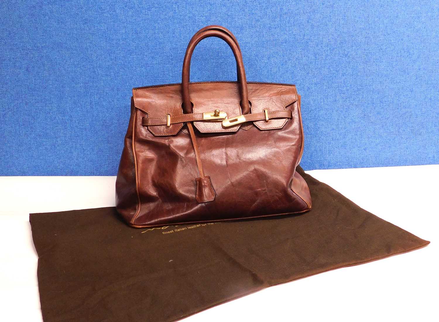 A chestnut brown leather bag by Maxwell Scott, approx 35cm wide with original dustbag