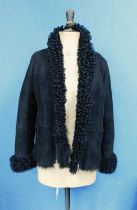 A lady's black suede and shearling slip-on jacket, front patch pockets, turn-up cuffs, shearling