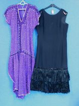 Two lady's circa 1980's cocktail dresses to include a purple beaded and sequinned dress with split