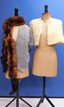 Two fur stoles and another, to include a cream astrakhan style fur cape, a brown fur stole and a