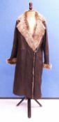 A ladys brown suede sheepskin coat, with suede outer and sheepskin collar, cuffs and lining, with