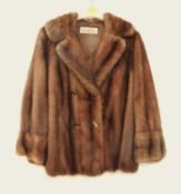 A lady's brown mink fur jacket by Max Martin, Glasgow, double breasted with faux tigers eye