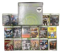 A boxed Xbox 360 Elite games console with all original manuals, leads and a quantity of various