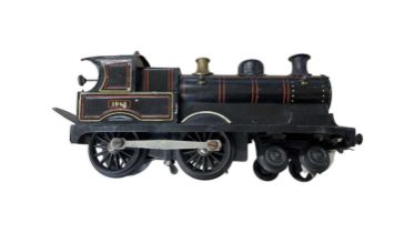 A Bing/Bassett-Lowke 0 gauge 4-4-0 Locomotive number 1942, in black livery.