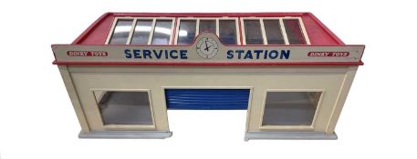 A vintage Dinky 785 Service Station, with original sliding doors.
