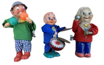 A trio of rubberised clockwork toys, to include: - Clown playing maracas - Bartender -