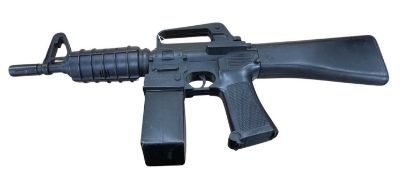 A 1985 LJN Entertech M-16 motorized machine water gun toy.
