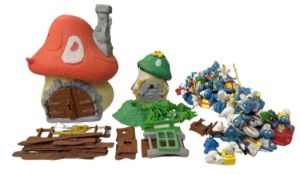 A collection of 1970s/80s Smurf mushroom houses, treehouse parts and a large collection of figures.