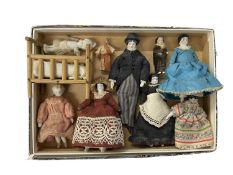 A group of Victorian miniature hand-painted porcelain dolls