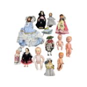 A mixed lot of vintage miniature dolls, to include celluloid, wooden and plastic examples