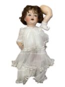 A very large Kammer and Reinhardt / Simon and Halbig bisque head doll, with brown flirty eyes and