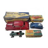 A mixed lot of boxed vintage plastic vehicles, to include: - A friction motor Cadillac by