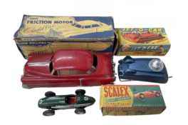 A mixed lot of boxed vintage plastic vehicles, to include: - A friction motor Cadillac by