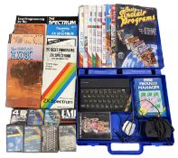 A Sinclair ZX Spectrum, together with a collection of cassettes, books and magazines