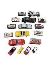 A mixed lot of various large unboxed die-cast sports cars and boxed model cars.