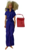 A 1976 Bionic Woman / Jaime Sommers action figure, in original jumpsuit with bag. Some damage to arm