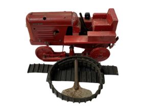 A die-cast clockwork David Brown tractor toy, with key. Track present, but damaged.