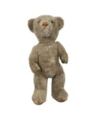 A vintage teddy bear, no makers mark. Length approximately: 43cm