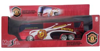 A boxed Maisto Manchester United team bus