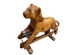A childrens' wooden rocking toy, formed as a lioness or puma. Dimensions approximately: 74 (floor to