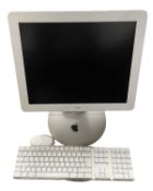 An Apple iMac G4 computer with keyboard and mouse. Serial number: W83500ZGQB6 Model: M6498