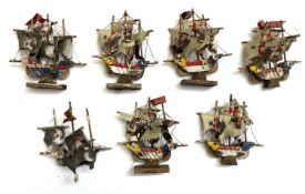 A set of leather and wooden Armada ships, marked Foreign.