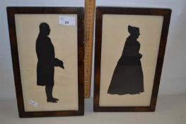 Pair of silhouette portrait pictures of a lady and gent