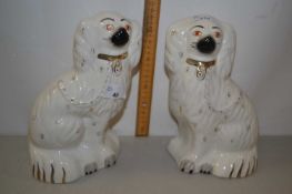Pair of Staffordshire model spaniels with gilt highlights