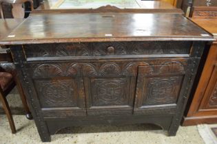 Heavily carved oak side cabinet with single drawer and over two doors, 127cm wide
