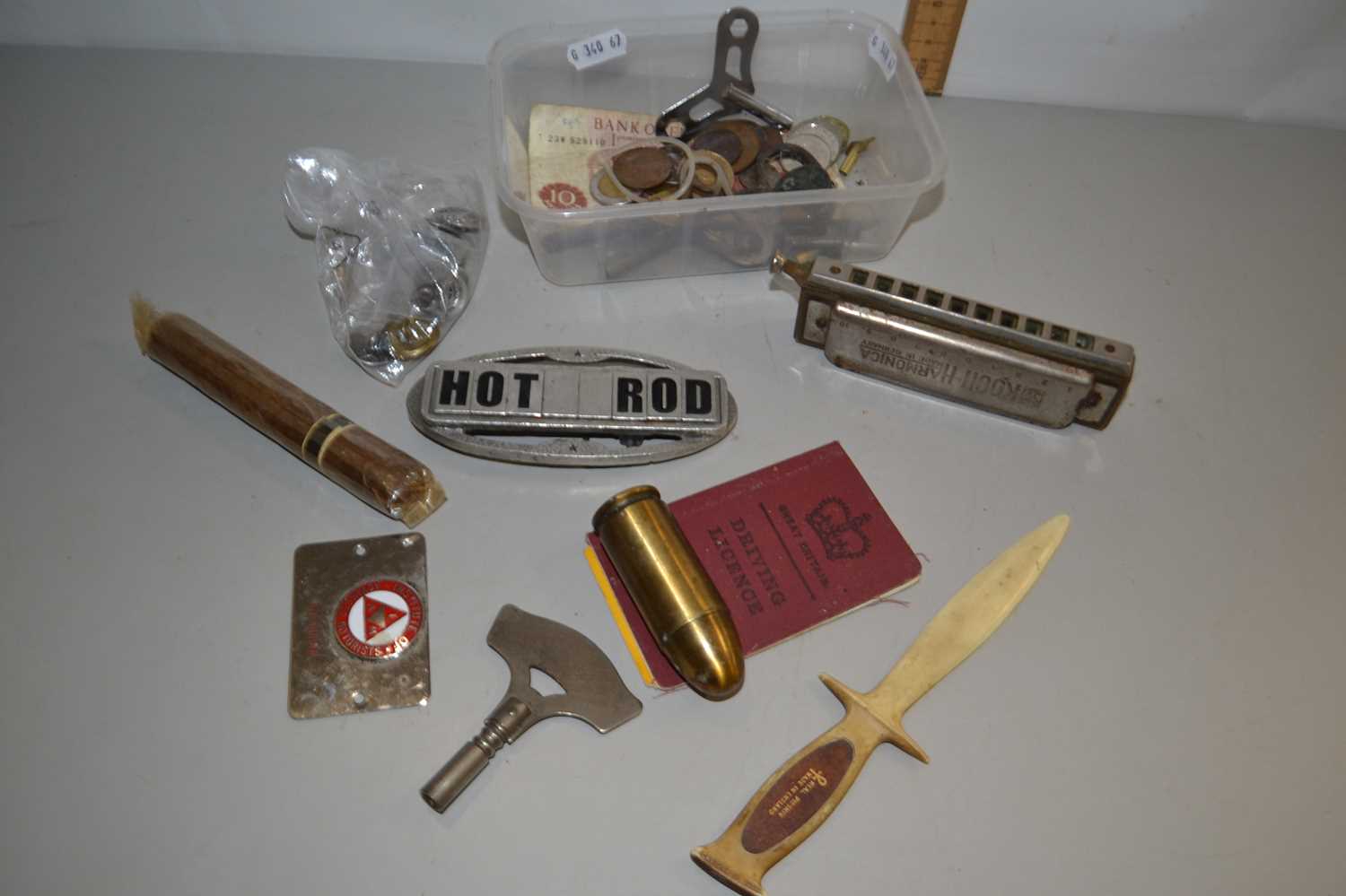 Box of various mixed items to include a mouth organ, vintage cigar, a Hunter bullet lighter etc