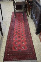 Red runner carpet with geometric design
