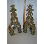 Pair of brass fire dogs formed as intertwined serpents