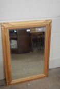Modern bevelled wall mirror in an antique style frame