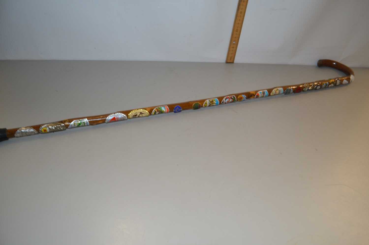 Walking stick mounted with various badges
