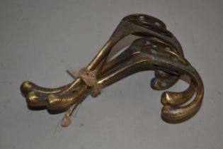 Set of four brass coat hooks