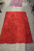 Modern red shaggy finish rug