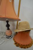 Modern table lamp together with a further shade and a lady's hat