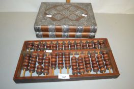 An abacus and a book formed jewellery box