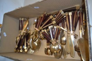 Quantity of brass cutlery with wood mounted handles