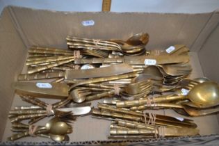 Quantity of brass cutlery with bamboo formed handles
