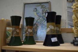Two pairs of vases and a needlework picture