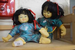 Pair of Oriental dolls