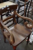 A Victorian hard seated scroll arm chair on turned legs, 50cm wide