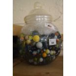Glass jar and a quantity of marbles