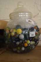 Glass jar and a quantity of marbles